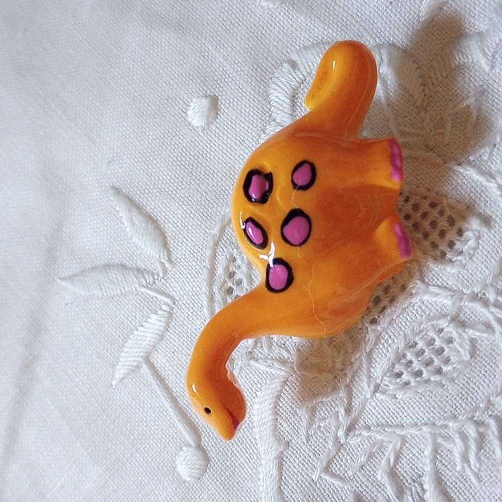 Adorable vintage Orange dinosaur w purple spots pin